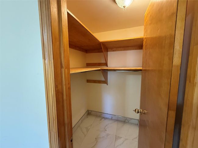 Spacious closet with marble finish floor | Image 17
