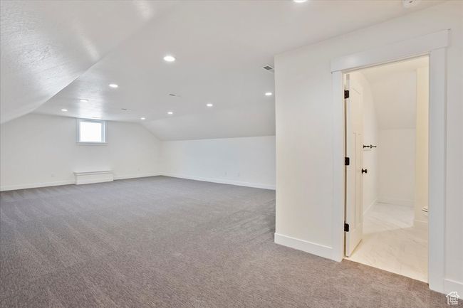 Bonus room with lofted ceiling, baseboards, carpet, and recessed lighting | Image 17