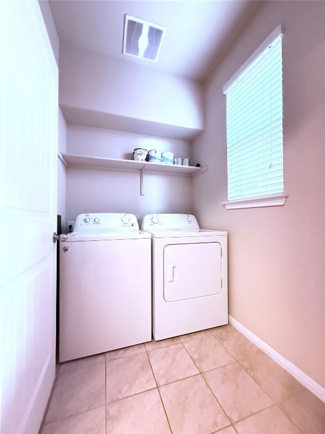 Washroom featuring washer and clothes dryer and light tile patterned flooring | Image 9