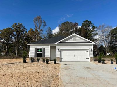 View of front of property with a garage | Image 1