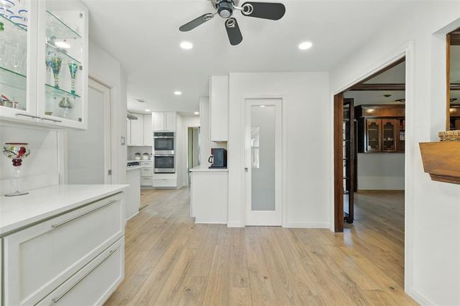 From this angle of the breakfast room you can see the entry to the walk-in pantry. | Image 9