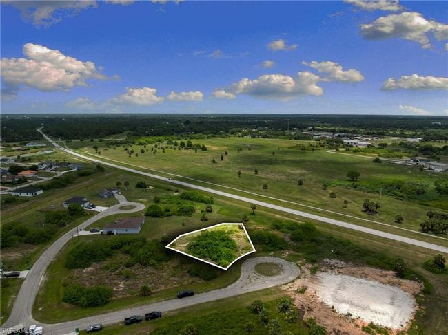 Aerial view of property's location with property parcel outlined and rural landscape | Image 7