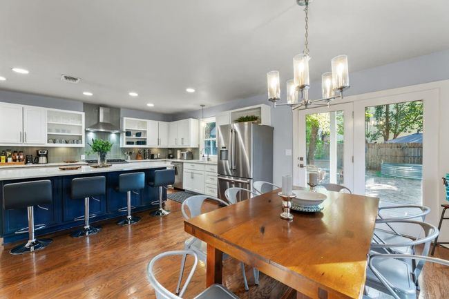 Dining area open to kitchen | Image 13