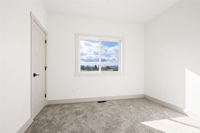 Carpeted empty room with baseboards | Image 31