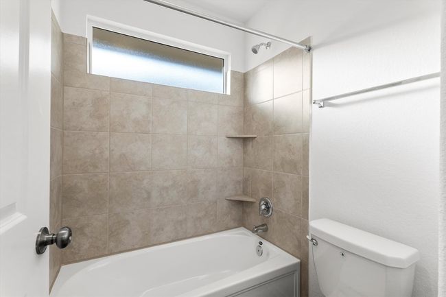 Bathroom with toilet and shower combination | Image 24