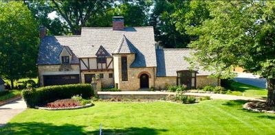 View of front of house featuring a garage and a front yard | Image 1