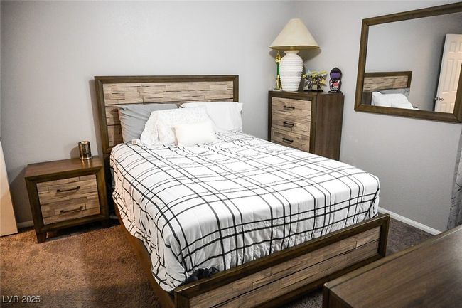 Bedroom with baseboards and carpet | Image 15