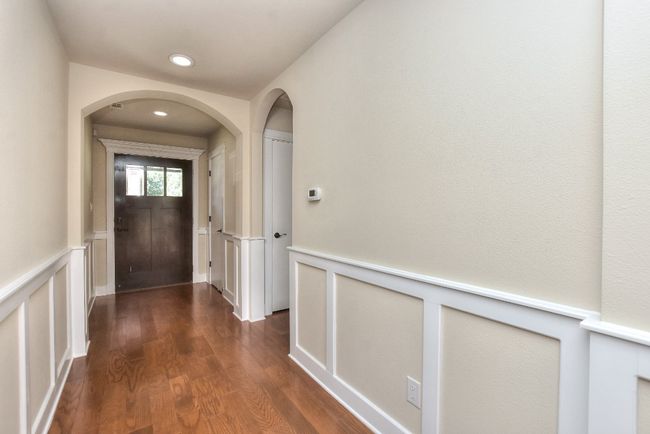 Hall from secondary bedrooms into kitchen and family room | Image 12