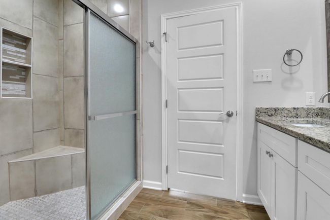 Primary bathroom features an oversized shower | Image 14