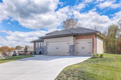 View of front facade featuring a garage and a front lawn | Image 2