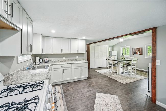 Kitchen opens to dining area & living room | Image 14
