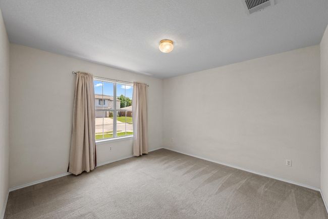 Carpeted empty room with baseboards | Image 21