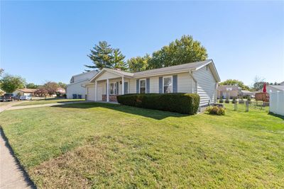 Ranch-style home with a front lawn | Image 2