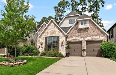 Two car garage with wide driveway for easy garage access. | Image 3