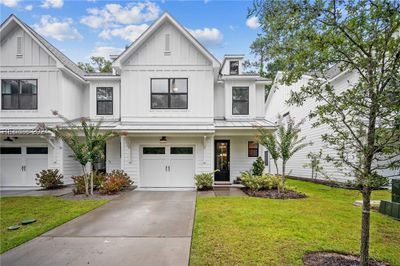 Modern farmhouse townhome features a 1 car garage | Image 1