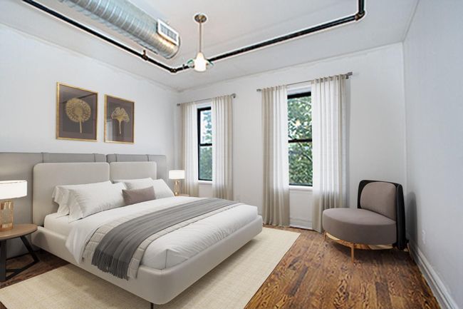 Bedroom with wood finished floors | Image 4