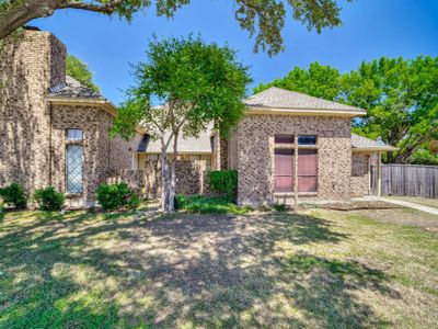 View of front facade with a front lawn | Image 2