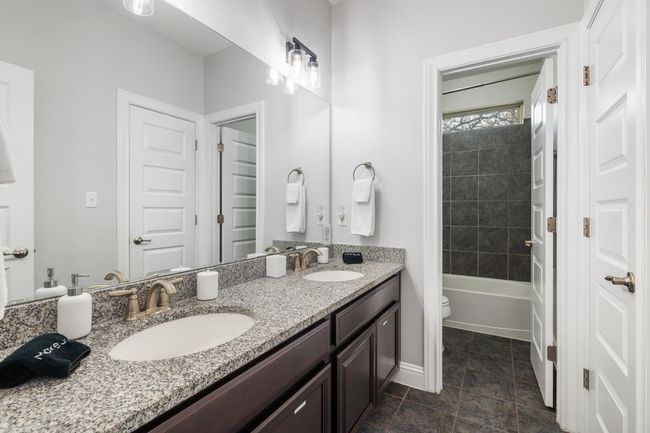 This third shared bathroom has a separate shower/tub combo that can be closed off by the door. | Image 32
