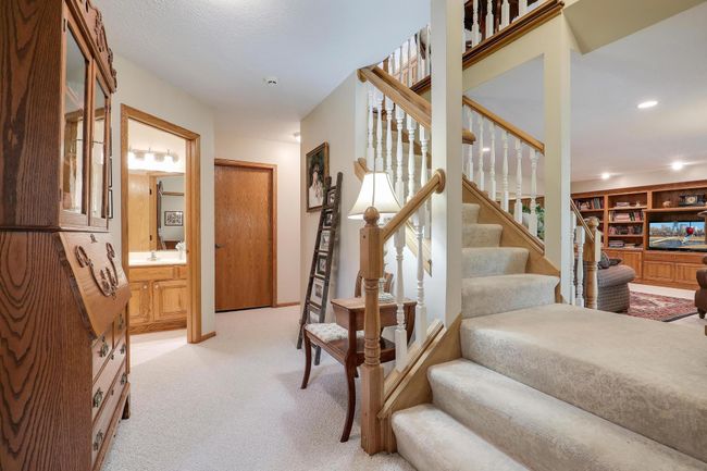 Lower level elegant open staircase. | Image 30