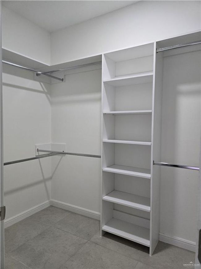 View of walk in closet in Master Bedroom | Image 8