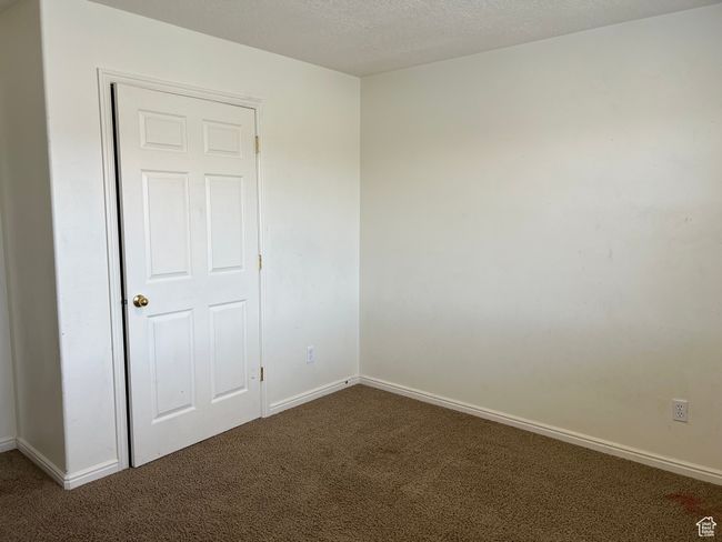 Carpeted empty room with baseboards | Image 6