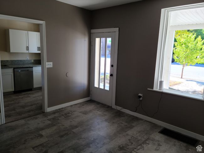 Entrance foyer featuring healthy amount of natural light, dark wood finished floors, and baseboards | Image 15