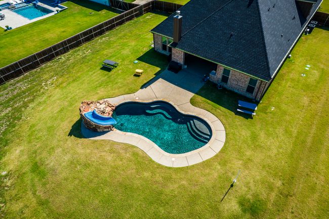 View from above of property with a pool area | Image 32