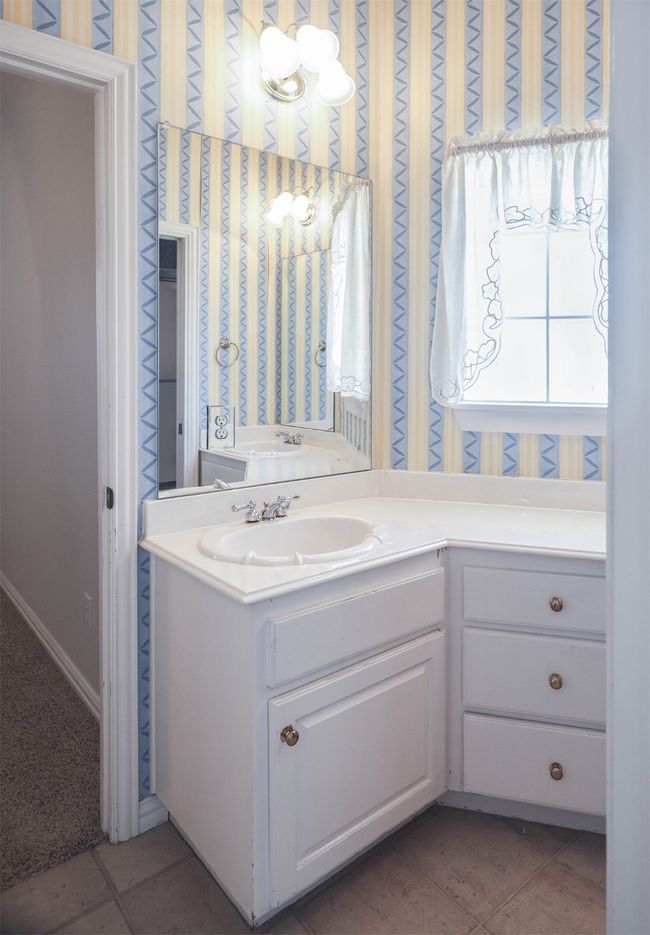 Bathroom with tile patterned flooring and vanity | Image 21