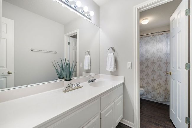 Guest bathroom upstairs has a large vanity area and a separate shower area. | Image 25