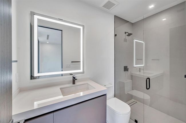 Bedroom 3 En Suite Bath with Custom Mirror and Pedini Cabinetry | Image 55