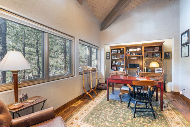 Office featuring hardwood / wood-style flooring, wood ceiling, high vaulted ceiling, and beamed ceiling | Image 22