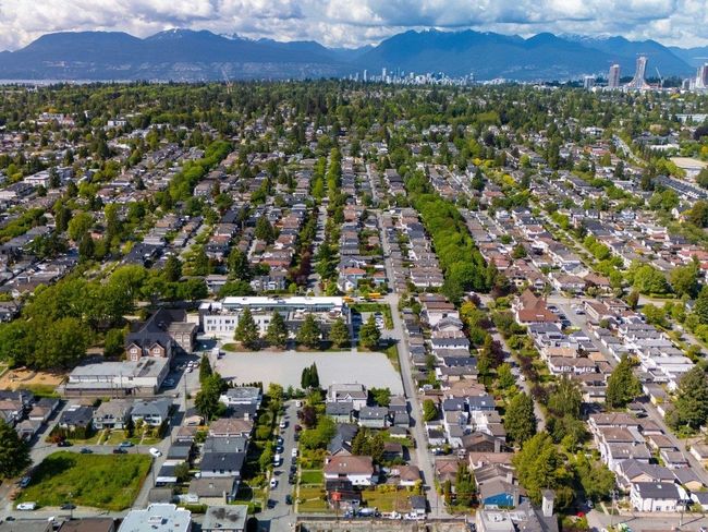 Aerial overview of property's location with mountains and nearby suburban area | Image 31