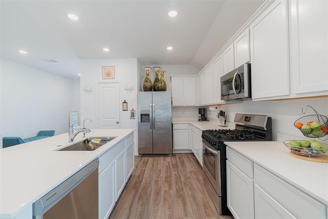 Kitchen features gas cooking and pantry. | Image 6