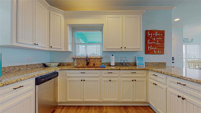 Enjoy a lovely view from your kitchen sink, overlooking the expansive outdoor space. | Image 17