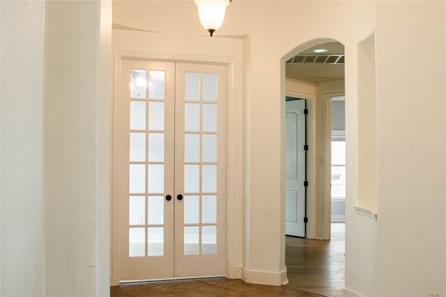 Entryway with french doors and arched walkways | Image 5