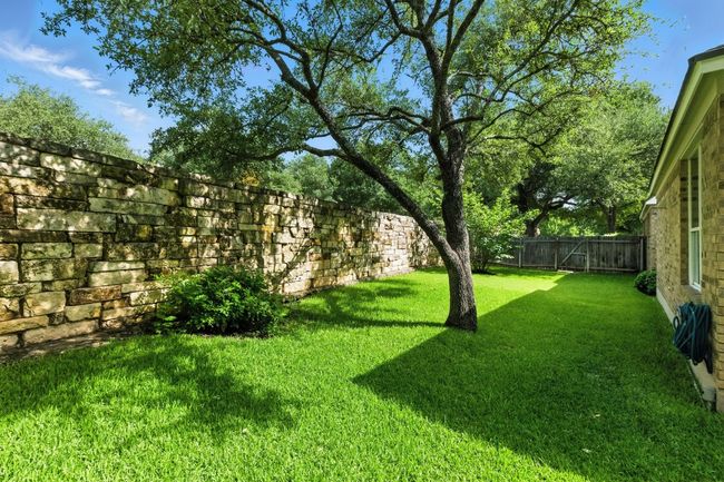 View of fenced backyard | Image 35