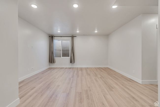 Unfurnished room with light wood-type flooring and recessed lighting | Image 23