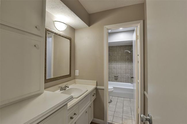 Secondary bathroom has lots of storage. | Image 22