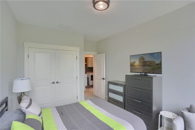 The accent wall behind the sink, pocket door and modern lighting and lighted mirrors make this a truly unique and very stylish space. | Image 37