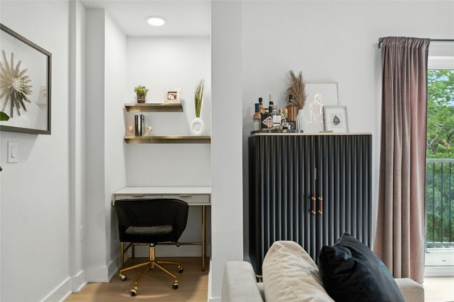 Home office featuring wood finished floors and baseboards | Image 4