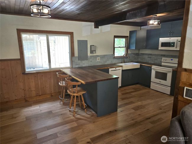View of kitchen and dining from living room. | Image 8