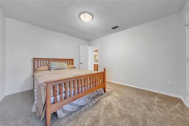 Bedroom with carpet and baseboards | Image 14
