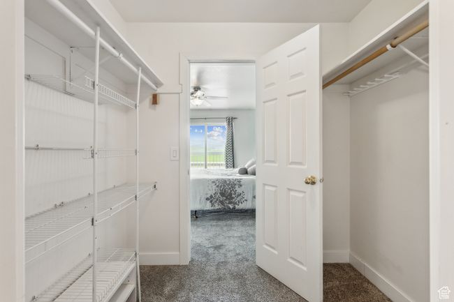 Walk in closet with carpet and a ceiling fan | Image 15