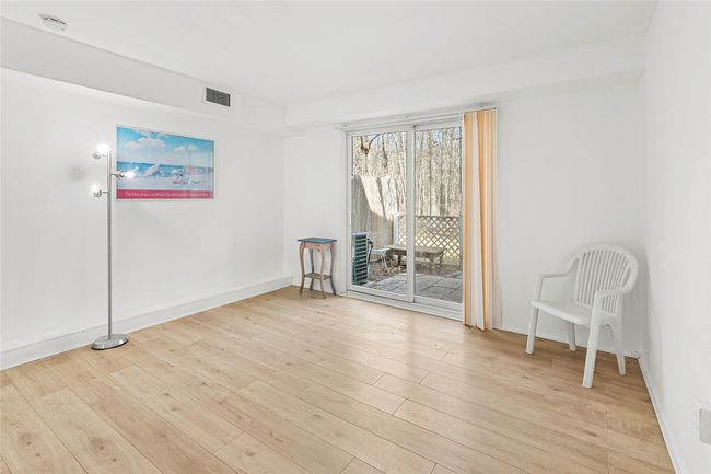 Spare room featuring light wood-style floors, visible vents, and baseboards | Image 5