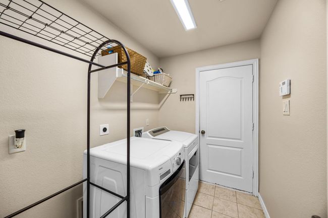 The utility room with gas and electric connections. | Image 33