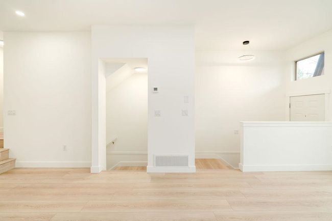 Interior space featuring baseboards, visible vents, and light wood-style floors | Image 35
