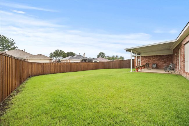 Fenced backyard featuring a patio | Image 30