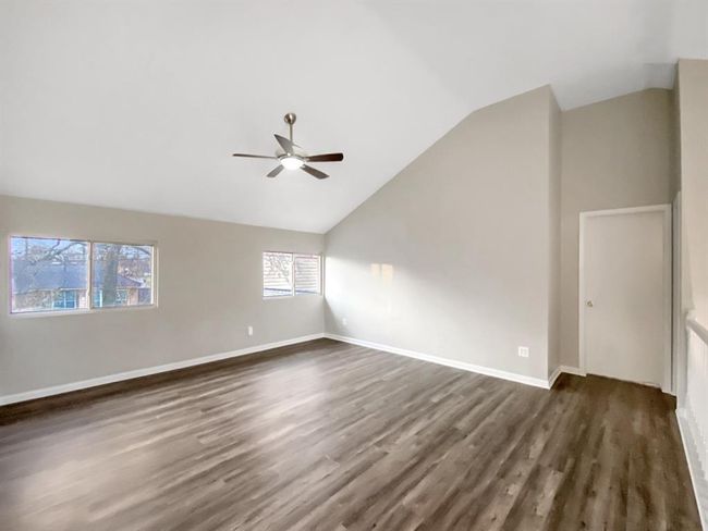 Spacious open room at the top of the stairs, perfect for multiple uses. | Image 14