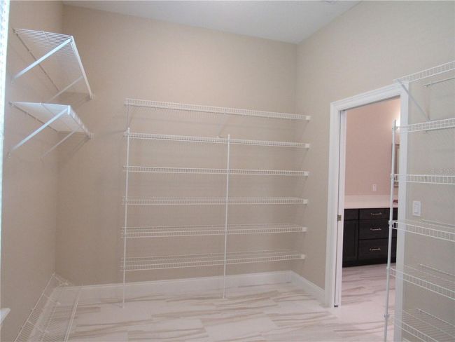 primary bedroom walk in closet | Image 38