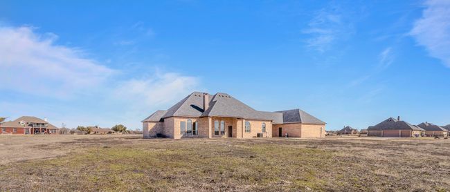 View of front of home with brick siding and a shingled roof | Image 36